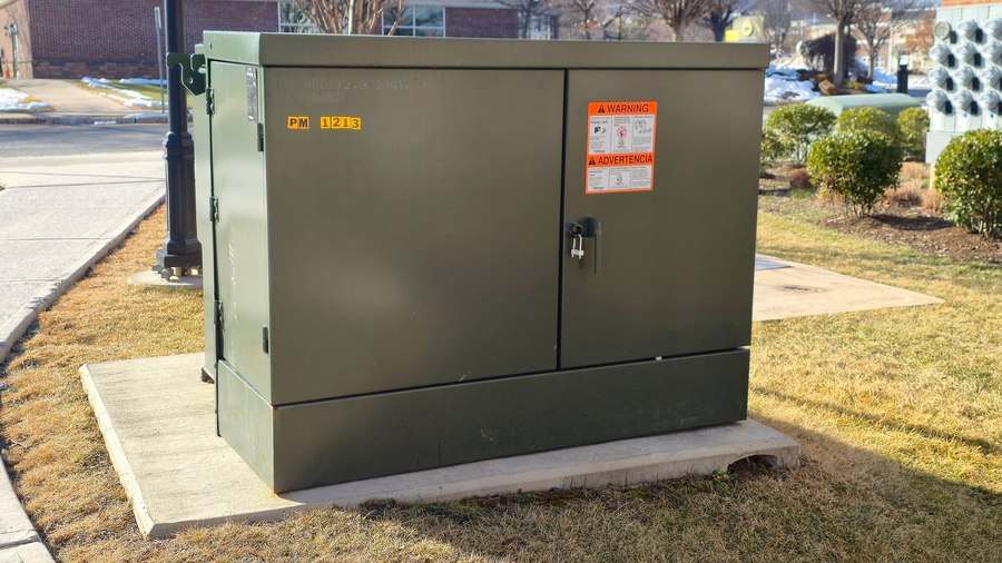 A pad-mounted transformer used for permanent or underground electrical infrastructure.